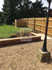 Retaining Garden Wall, Slabs, Screening & Featheredge Fence